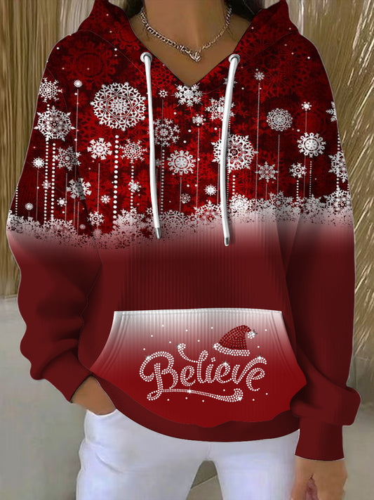Dámský hoodie s sněhovými vločkami a nápisem „Believe“ – vánoční styl v jarní barvě